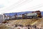 British Columbia Railway train with BCOL #728 leading nears yard.